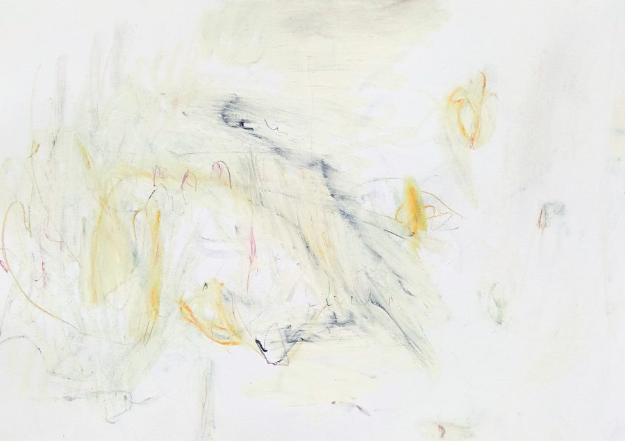 Landscape sheet of near-white paper, very pale throughout. A grey-blue hatched smear falls through the middle from upper left to lower right, carrying small graphite marks along it like a line of handwriting and ending in one black wedge low at the centre. Left of it, pale yellow arcs stack into a loose vertical cluster threaded with thin pink and coral filaments and a few orange hooks; two small orange loops hang alone in the upper right, and the right third is almost empty paper with only a few tiny flecks. Faint, airy and warm, with one cool diagonal holding it together.
